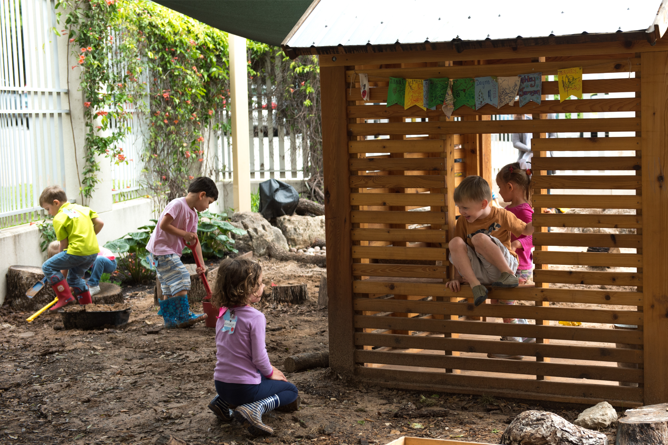 Several children play on a playground 